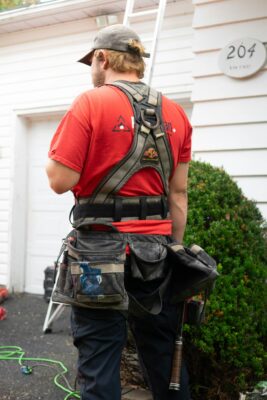 Roofer wearing harness